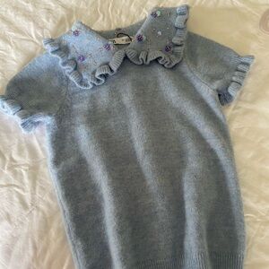 Baby blue knit top with beaded collar